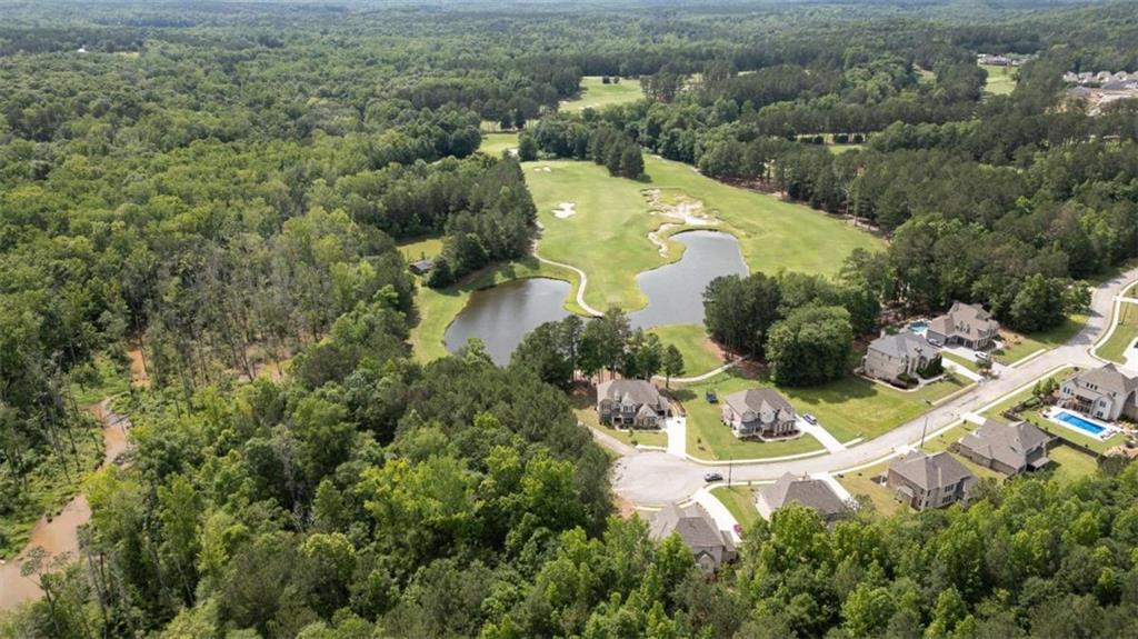 462 Manchester Lane Villa Rica, GA 30180 - Photo 13 of 13 an aerial view of a house with a yard and lake view