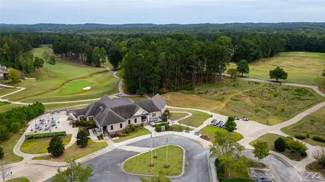 a view of a swimming pool with a yard