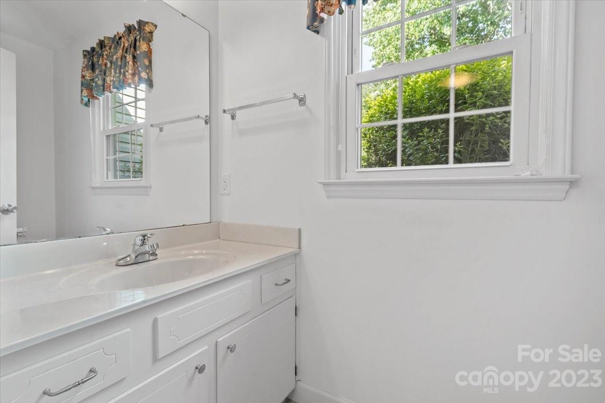 12112 Painted Tree Road Charlotte, NC 28226 - Photo 15 of 41 a bathroom with a sink and a mirror