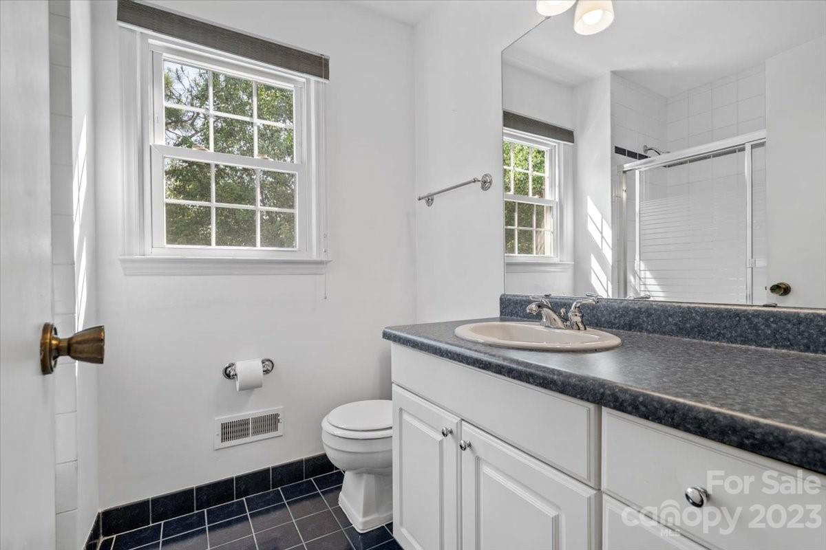 12112 Painted Tree Road Charlotte, NC 28226 - Photo 20 of 41 a bathroom with a granite countertop sink toilet and mirror