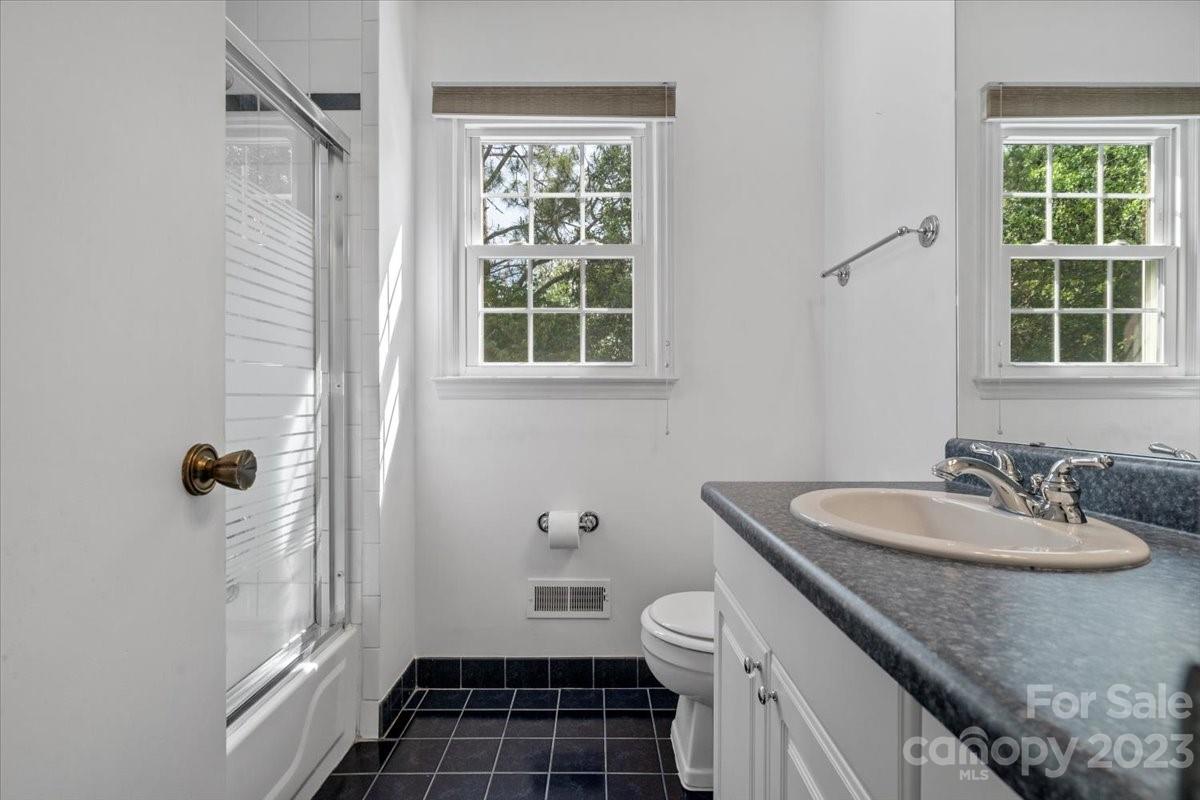 12112 Painted Tree Road Charlotte, NC 28226 - Photo 21 of 41 a bathroom with a sink a toilet a window and shower
