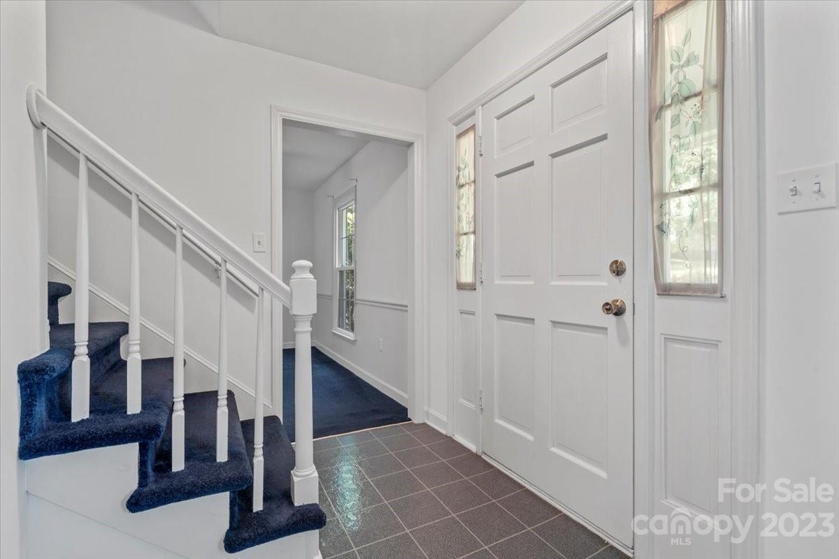 12112 Painted Tree Road Charlotte, NC 28226 - Photo 3 of 41 a view of entryway with wooden floor and stair