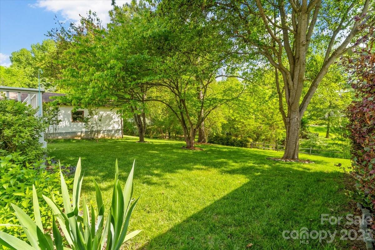 12112 Painted Tree Road Charlotte, NC 28226 - Photo 36 of 41 a view of yard with swimming pool and green space