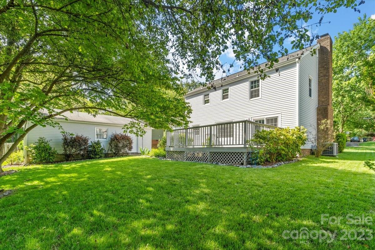 12112 Painted Tree Road Charlotte, NC 28226 - Photo 38 of 41 a view of a house with a yard and large trees