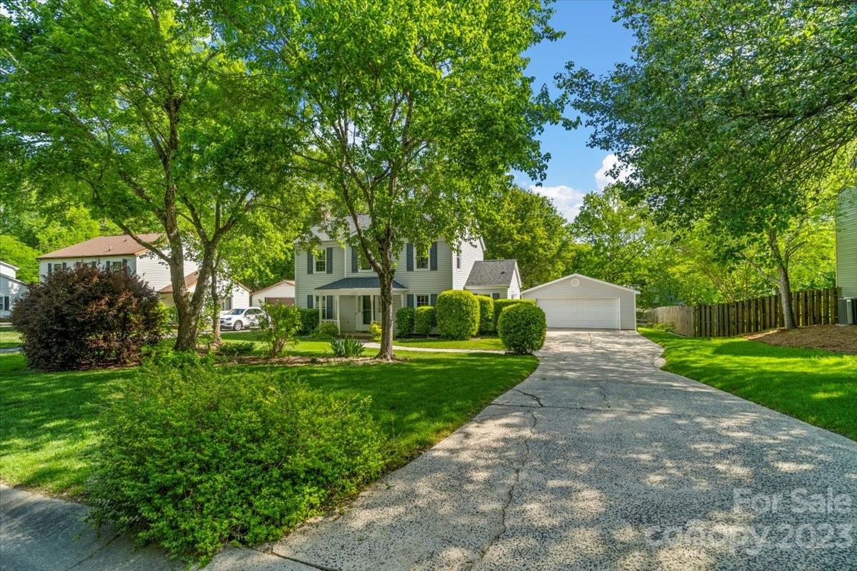 12112 Painted Tree Road Charlotte, NC 28226 - Photo 40 of 41 a front view of a house with a yard and trees