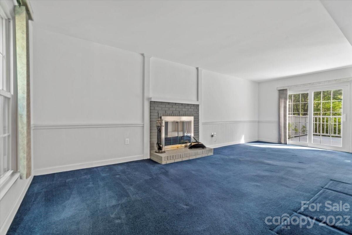 12112 Painted Tree Road Charlotte, NC 28226 - Photo 4 of 41 an empty room with fireplace