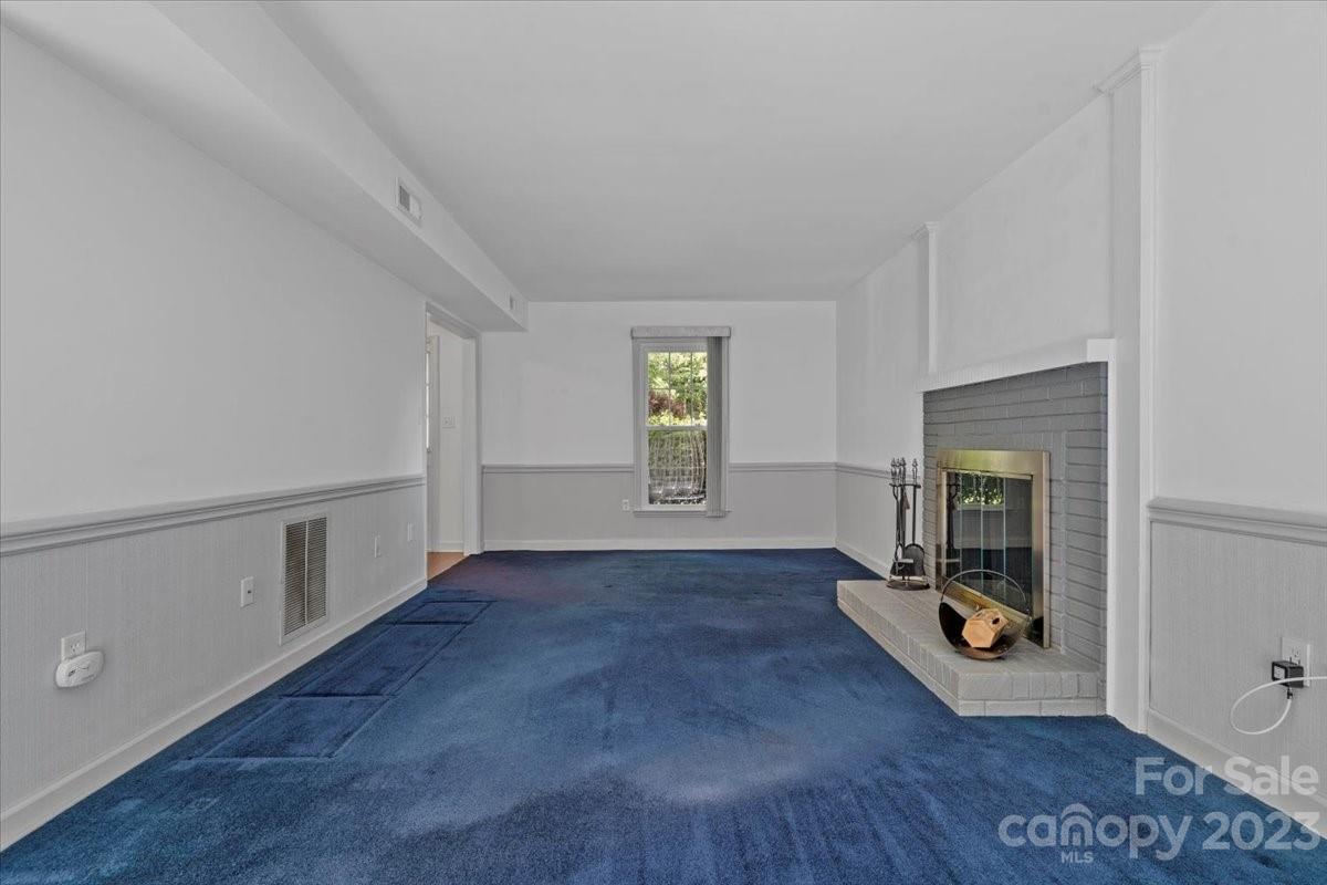 12112 Painted Tree Road Charlotte, NC 28226 - Photo 7 of 41 an entryway at livingroom with furniture and wooden floor