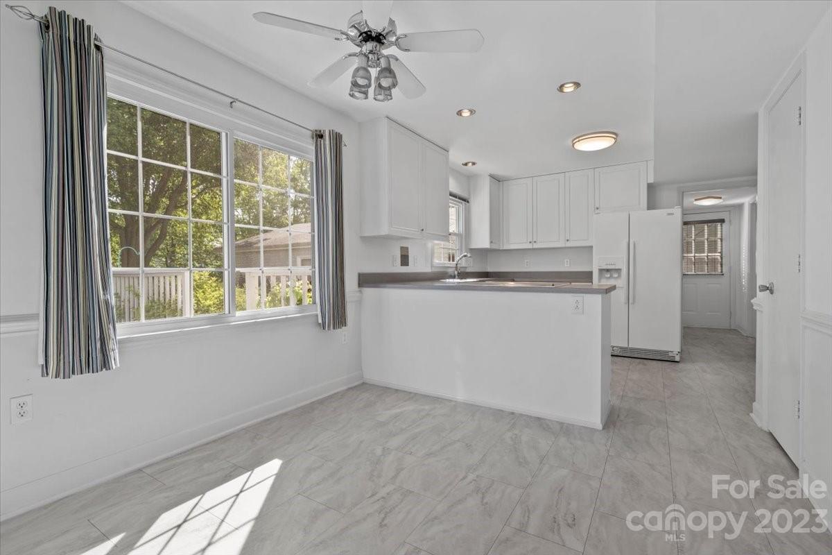 12112 Painted Tree Road Charlotte, NC 28226 - Photo 8 of 41 a kitchen with stainless steel appliances granite countertop a stove a sink and a refrigerator
