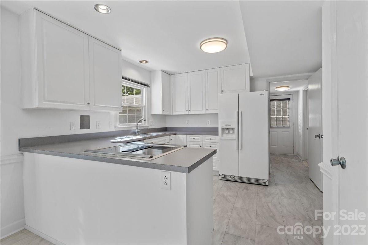 12112 Painted Tree Road Charlotte, NC 28226 - Photo 10 of 41 a kitchen with a sink stove and refrigerator