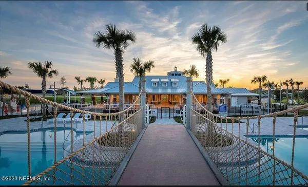 a view of a swimming pool and lounge chair