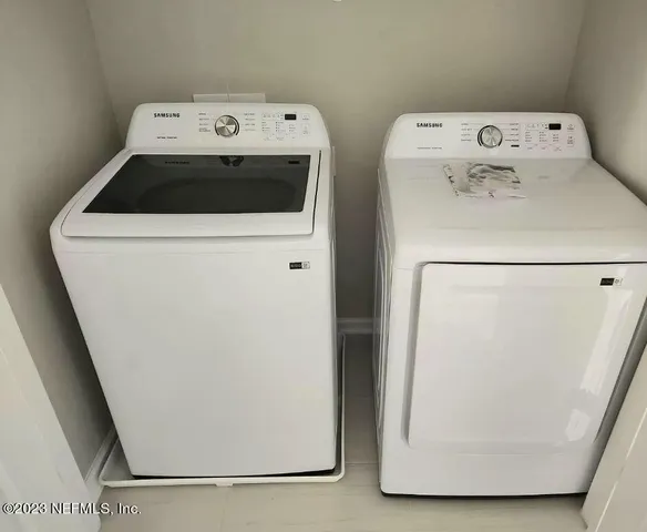 a utility room with dryer and washer