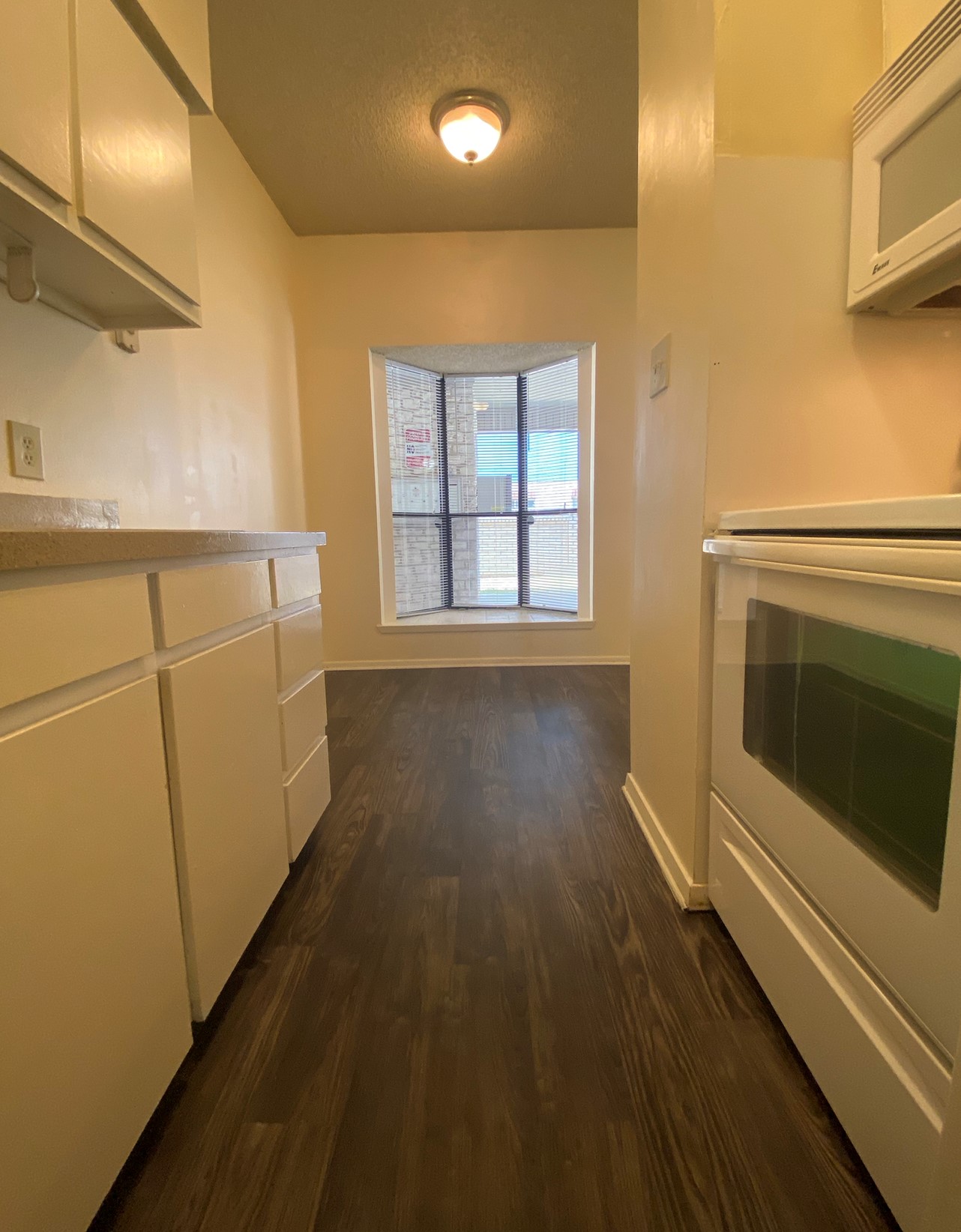 2604 Salado Street, Unit 102 Austin, TX 78705 - Photo 5 of 8 a view of a hallway with wooden floor and staircase