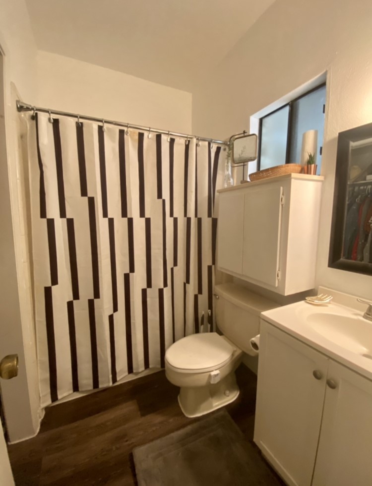 2604 Salado Street, Unit 102 Austin, TX 78705 - Photo 7 of 8 a bathroom with a sink toilet and shower