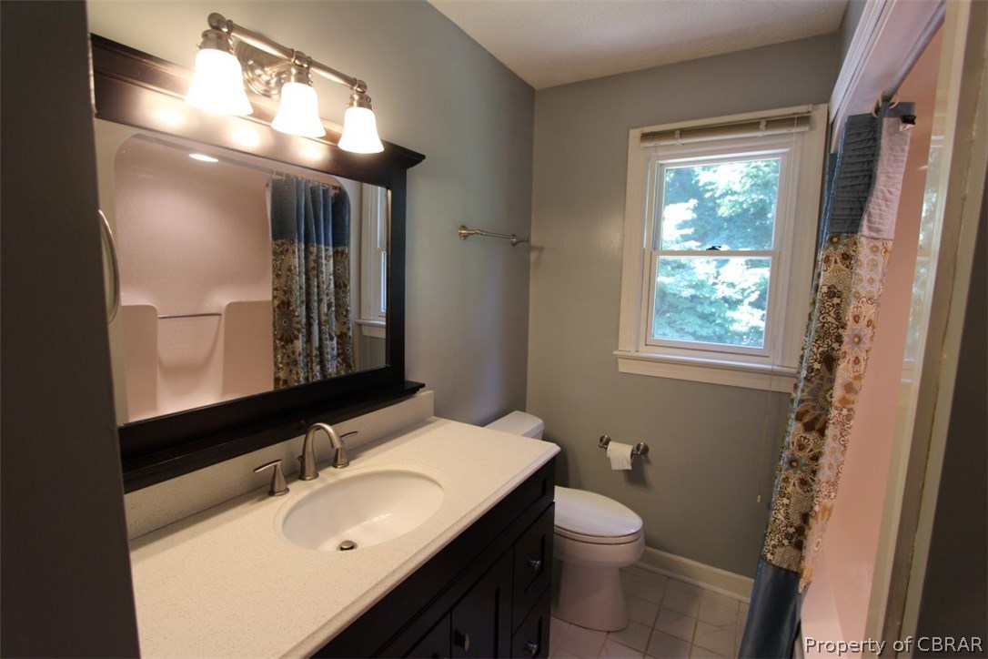 308 Tides Run Yorktown, VA 23692 - Photo 21 of 34 a bathroom with a sink vanity mirror and toilet