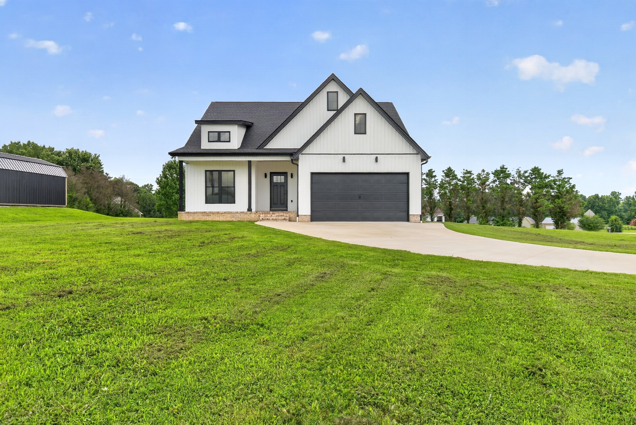 28 Harding Road Leoma, TN 38468 - Photo 1 of 36 a front view of a house with yard