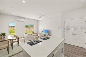 14989 Sunset Eve Loop Fort Myers, FL 33919 - Photo 3 of 9 a living room with furniture and a large window