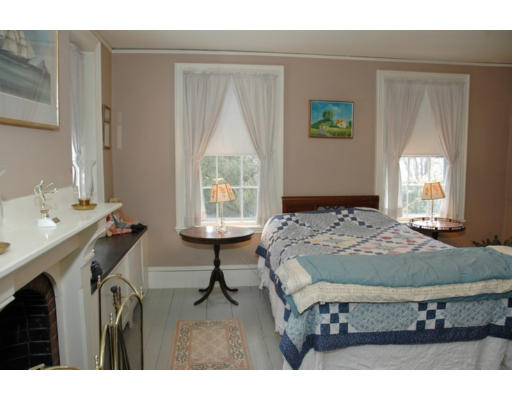 106 Elm Street Concord, MA 01742 - Photo 4 of 15 a bed sitting in a bedroom next to a window