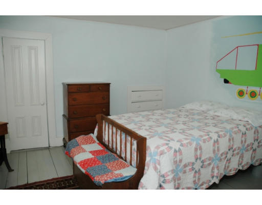 106 Elm Street Concord, MA 01742 - Photo 5 of 15 a bedroom with a bed and a window