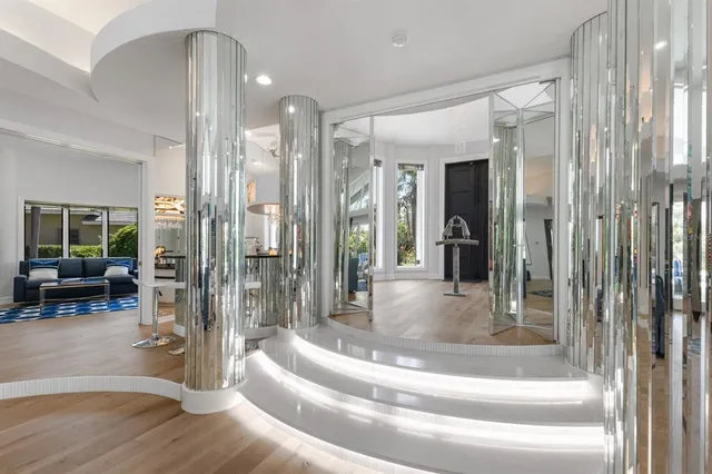 a dining room with furniture window and wooden floor
