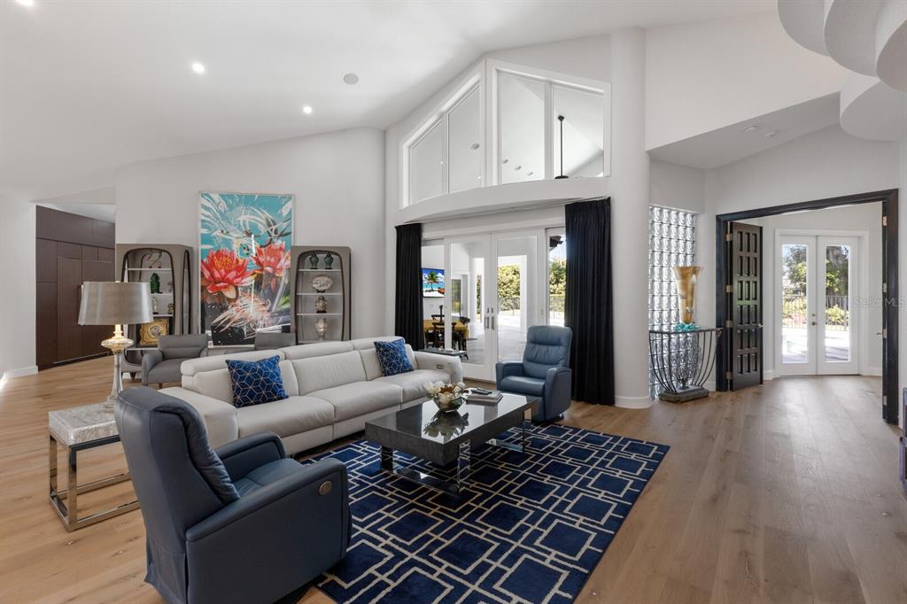 691 Eagle Watch Lane Osprey, FL 34229 - Photo 18 of 100 a living room with furniture and a chandelier
