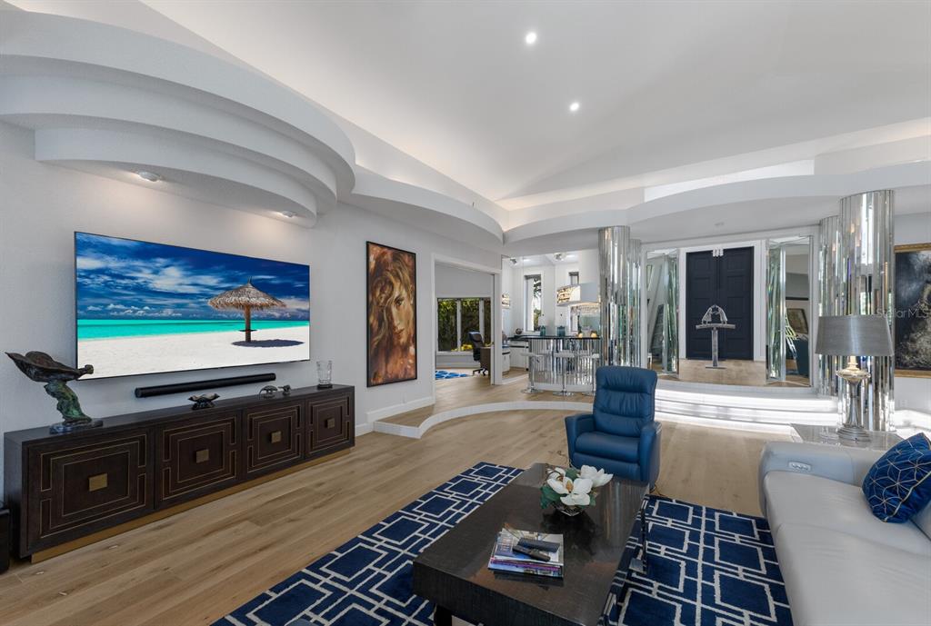691 Eagle Watch Lane Osprey, FL 34229 - Photo 21 of 100 a living room with furniture and a flat screen tv