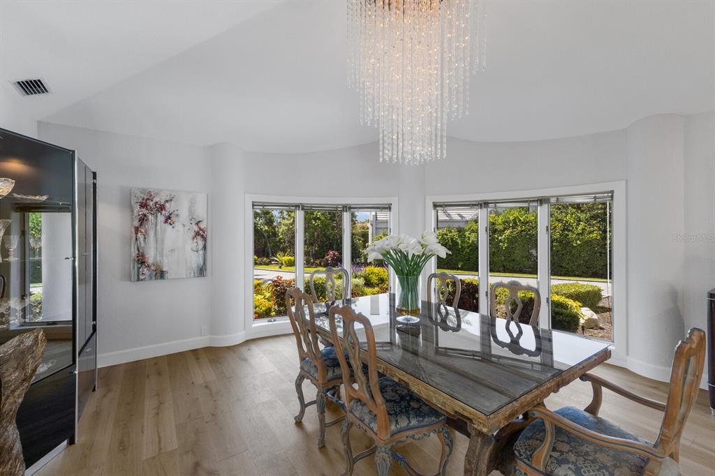 691 Eagle Watch Lane Osprey, FL 34229 - Photo 25 of 100 a view of a dining room with furniture window and outside view