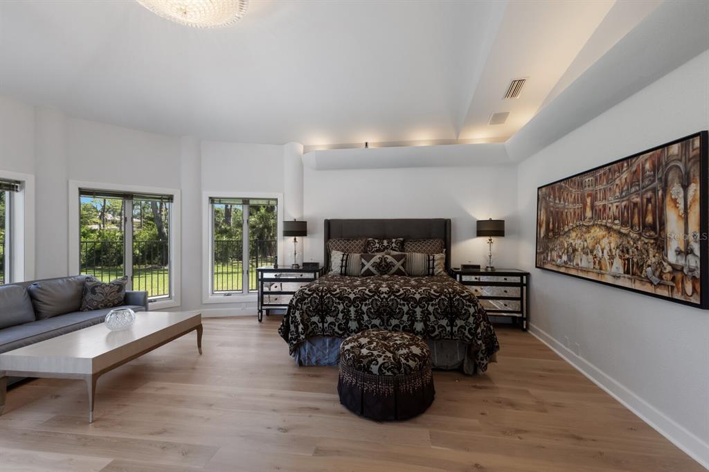 691 Eagle Watch Lane Osprey, FL 34229 - Photo 33 of 100 a bed room with furniture and wooden floor