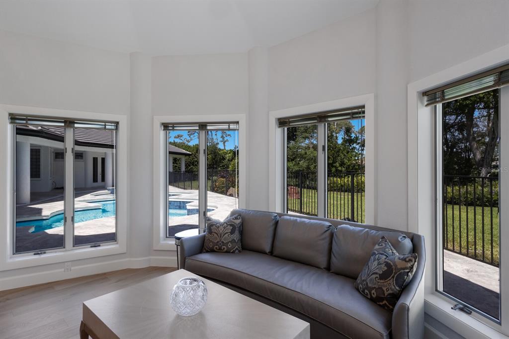 691 Eagle Watch Lane Osprey, FL 34229 - Photo 35 of 100 a living room with furniture and a large window