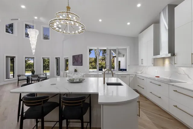 an aerial view of a house with yard swimming pool and outdoor seating