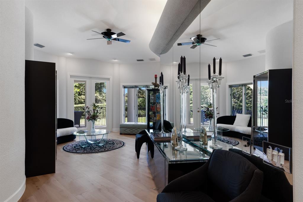 691 Eagle Watch Lane Osprey, FL 34229 - Photo 62 of 100 a living room with furniture kitchen view and a large window