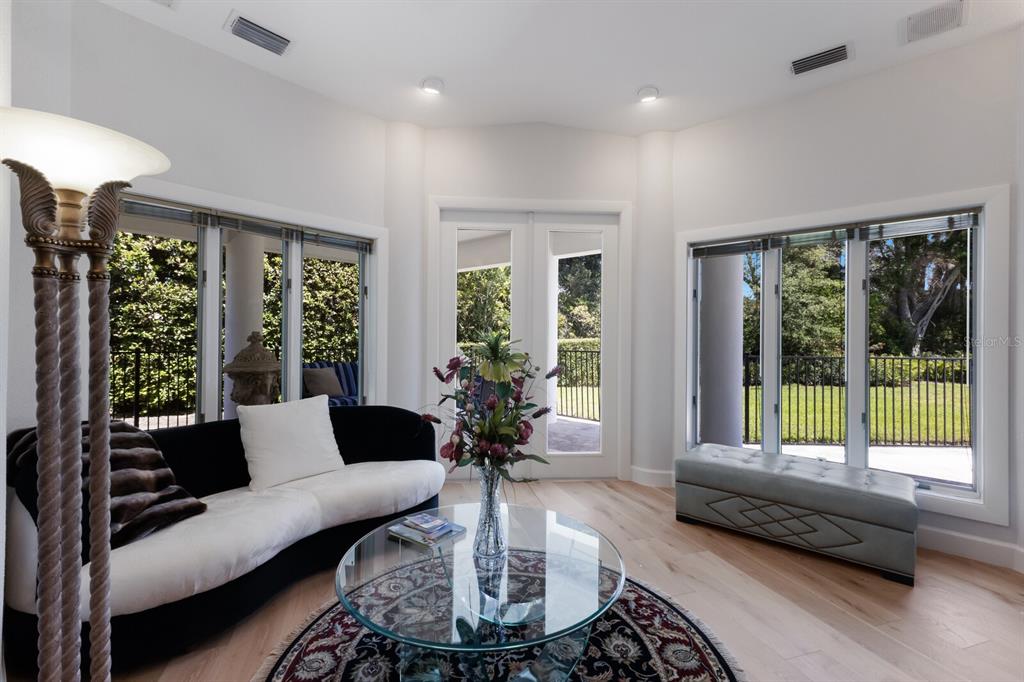 691 Eagle Watch Lane Osprey, FL 34229 - Photo 63 of 100 a living room with furniture and a large window