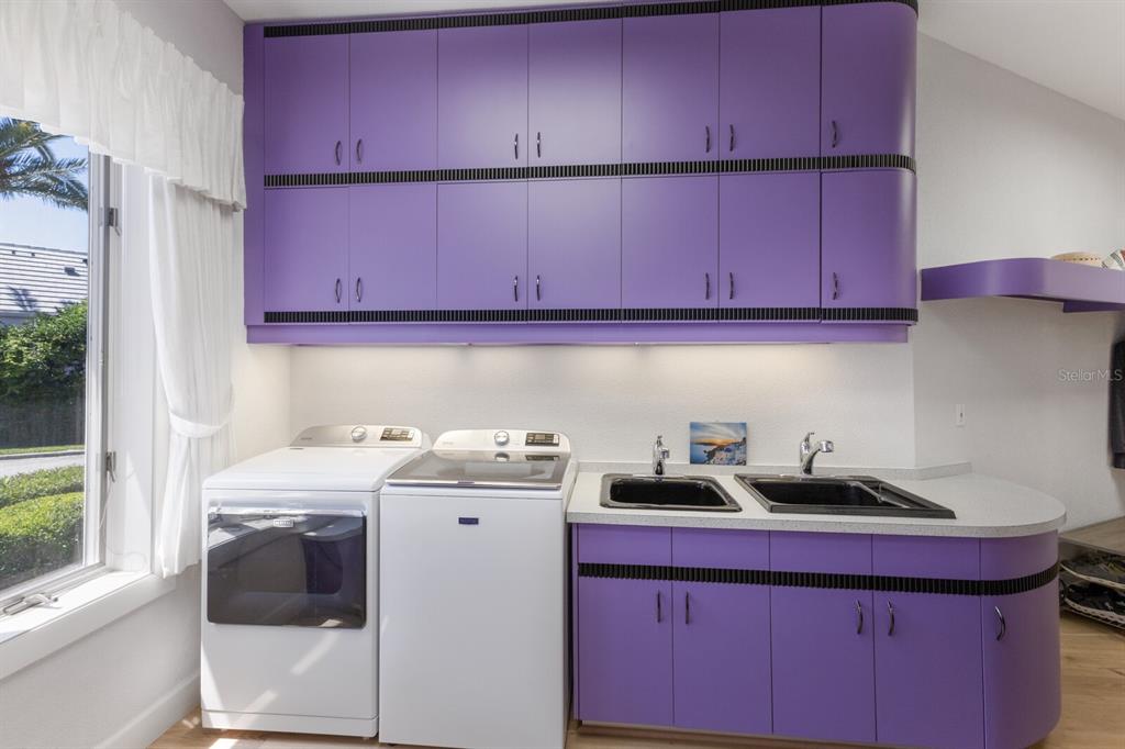 691 Eagle Watch Lane Osprey, FL 34229 - Photo 72 of 100 a kitchen with a sink and cabinets