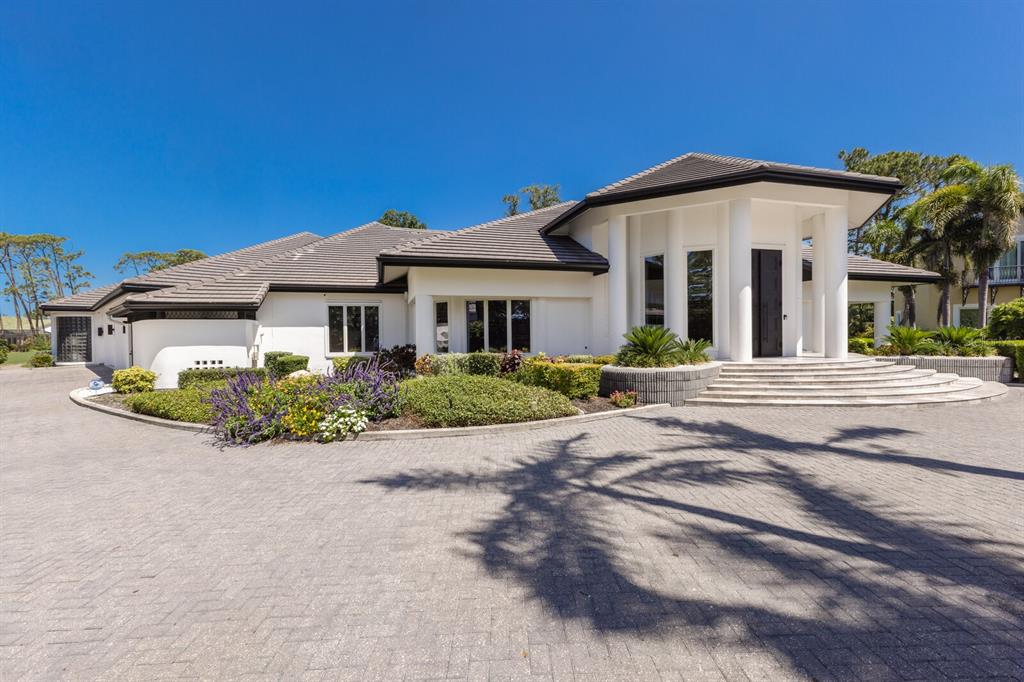 691 Eagle Watch Lane Osprey, FL 34229 - Photo 8 of 100 a front view of a house with a yard