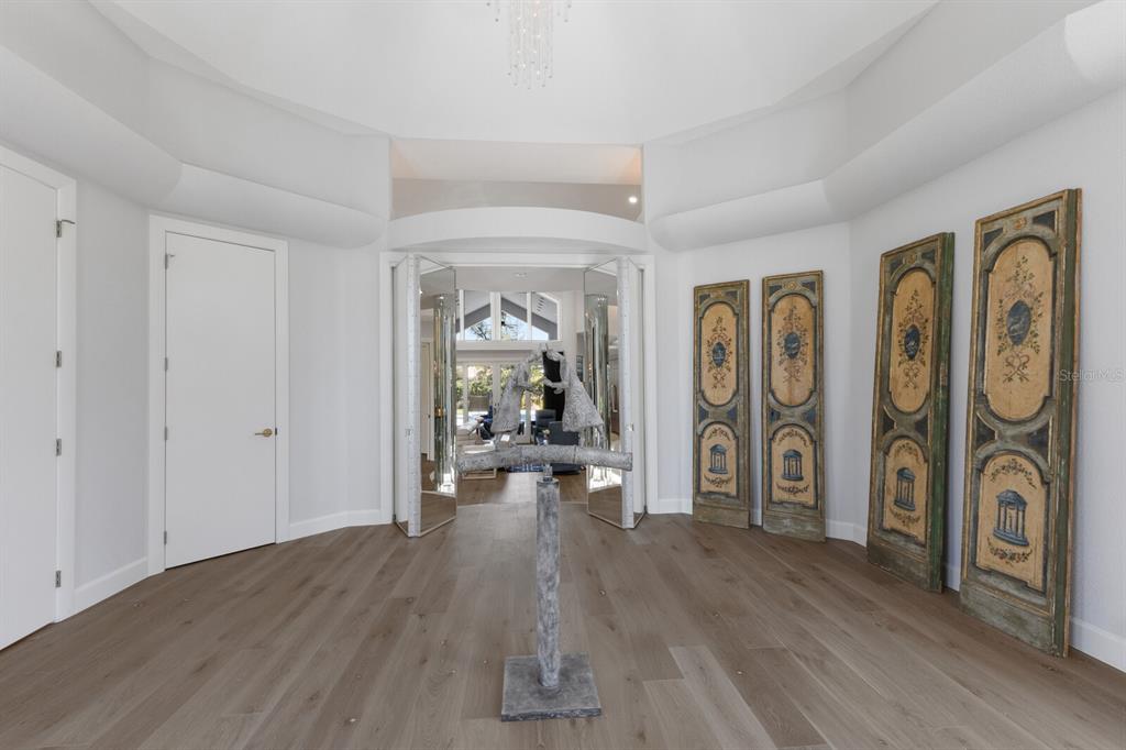 691 Eagle Watch Lane Osprey, FL 34229 - Photo 9 of 100 a view of a livingroom with wooden floor and furniture