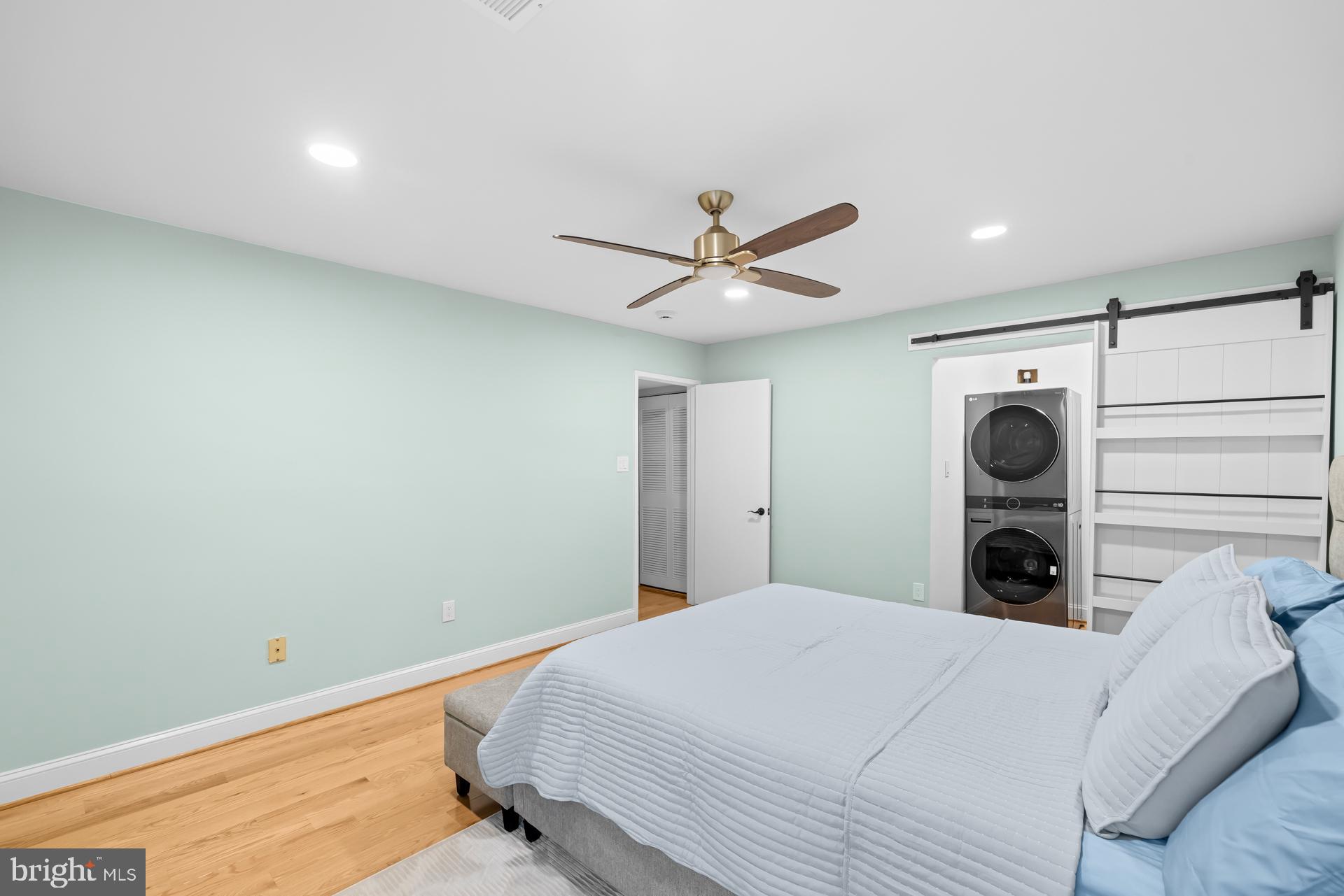 9820 Georgia Avenue, Unit 21302 Silver Spring, MD 20902 - Photo 19 of 24 Serene bedroom with modern touches.