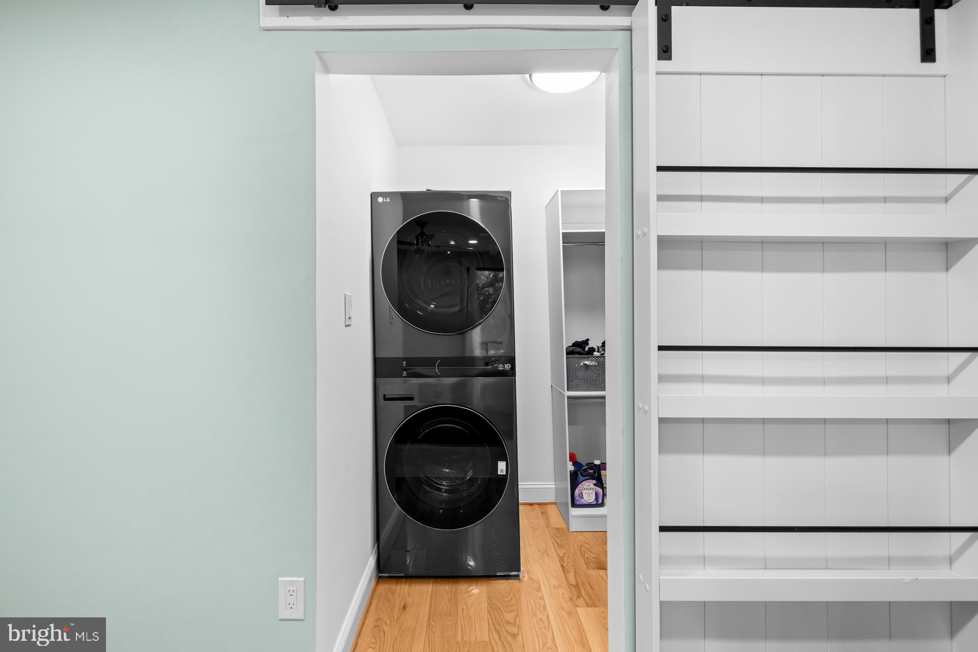 9820 Georgia Avenue, Unit 21302 Silver Spring, MD 20902 - Photo 21 of 24 Modern laundry nook with sleek appliances.