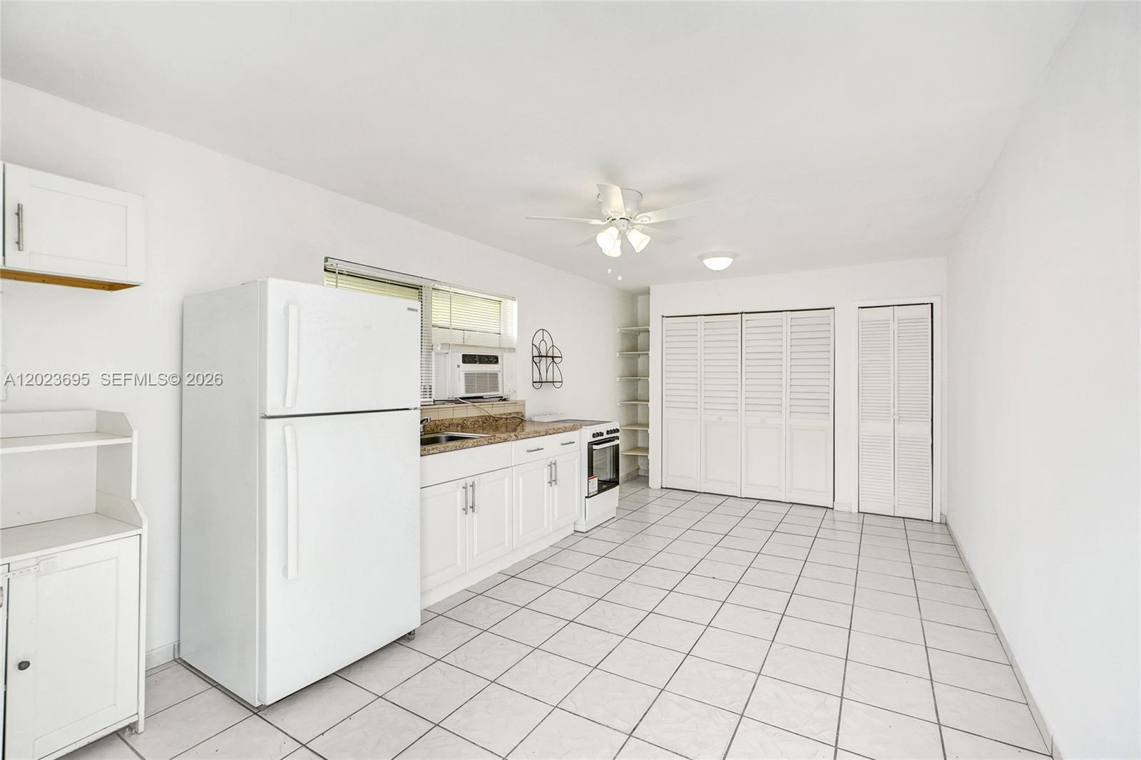 877 West 33rd Street, Unit A Hialeah, FL 33012 - Photo 11 of 36 Kitchen/Family/Dining Area