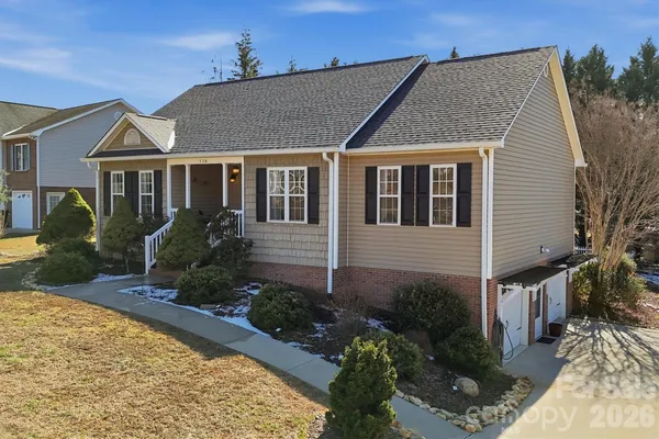 a aerial view of a house with a yard