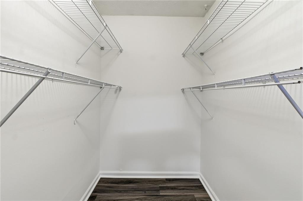 1150 Collier Road Northwest, Unit 24K Atlanta, GA 30318 - Photo 11 of 22 a view of a room with racks on the wall