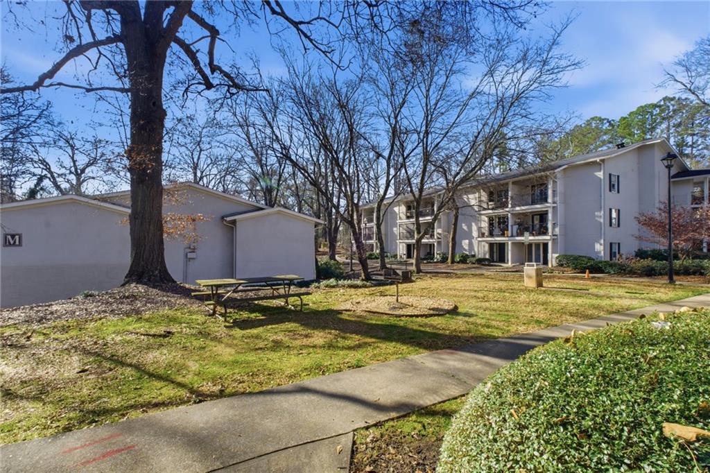 1150 Collier Road Northwest, Unit 24K Atlanta, GA 30318 - Photo 21 of 22 a view of a house with snow on the background