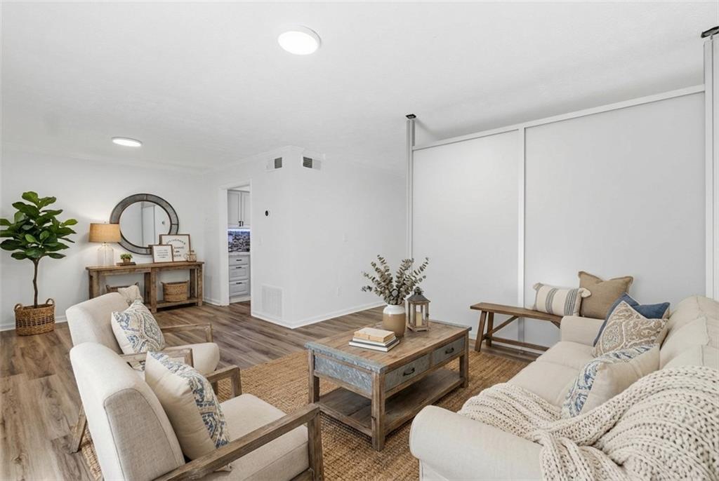 1150 Collier Road Northwest, Unit 24K Atlanta, GA 30318 - Photo 5 of 22 a living room with furniture