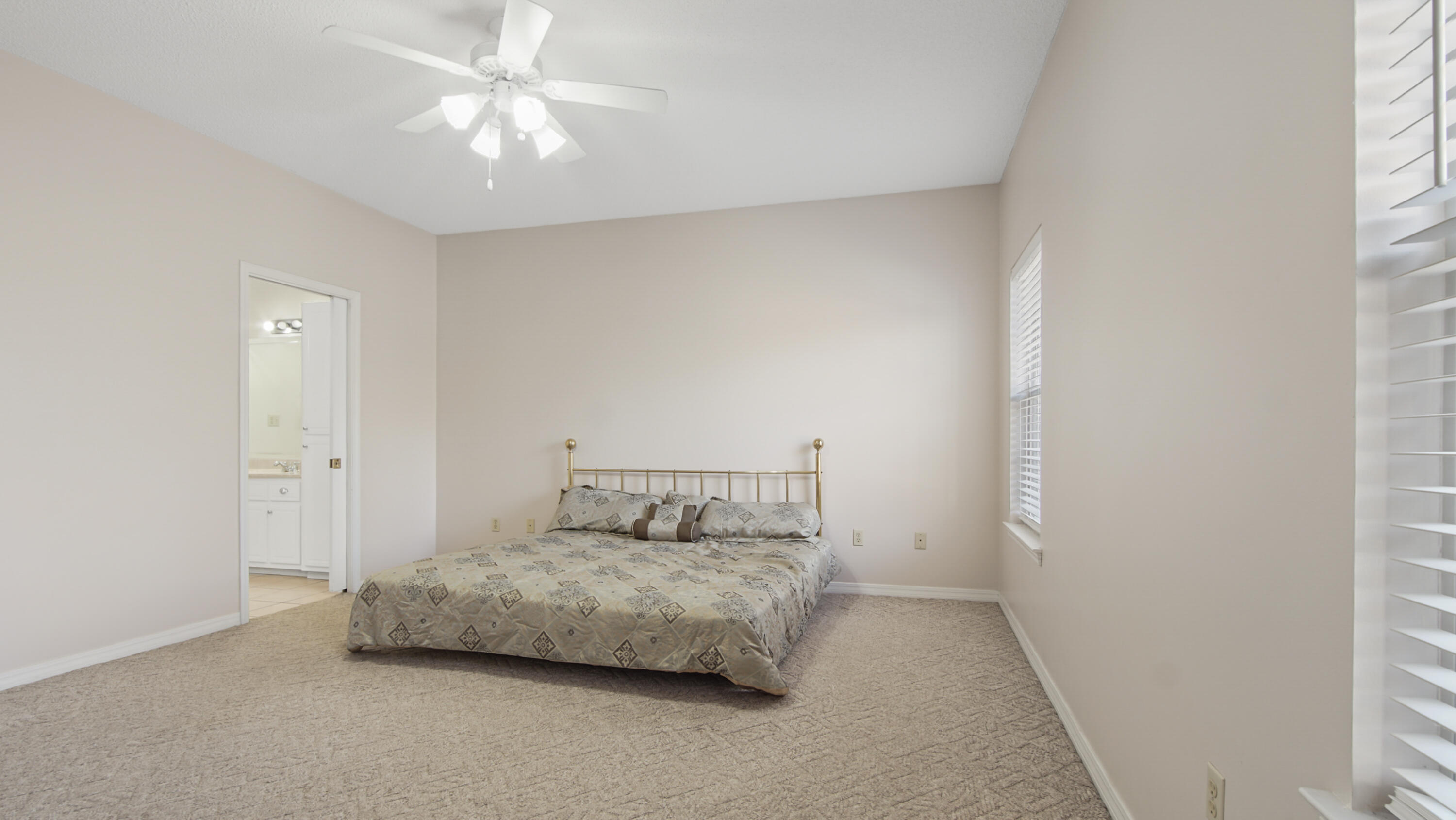 1333 Parrish Road Florala, AL 36442 - Photo 15 of 48 a bedroom with a bed and a ceiling fan