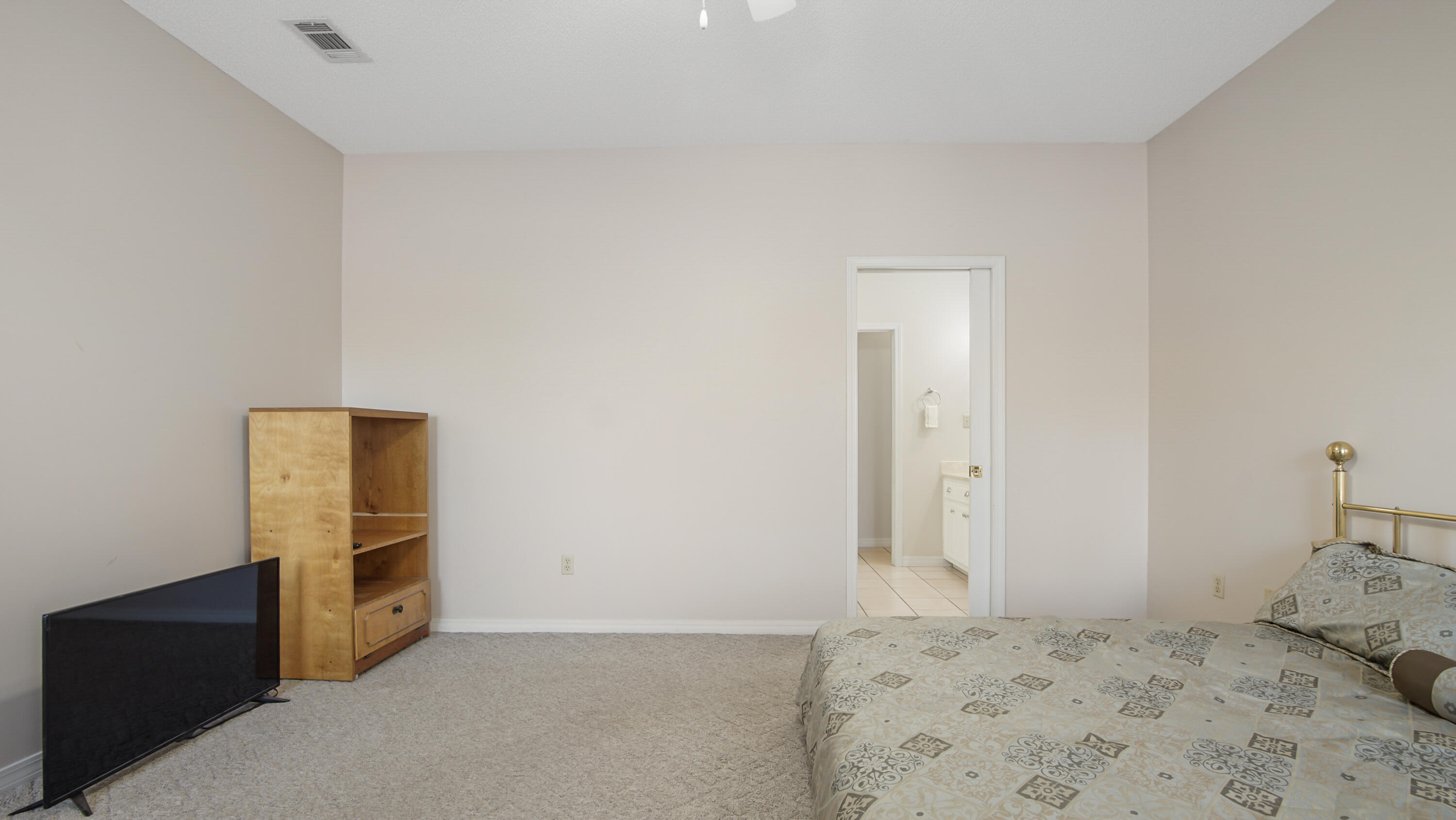 1333 Parrish Road Florala, AL 36442 - Photo 16 of 48 a bedroom with a bed and a cabinets