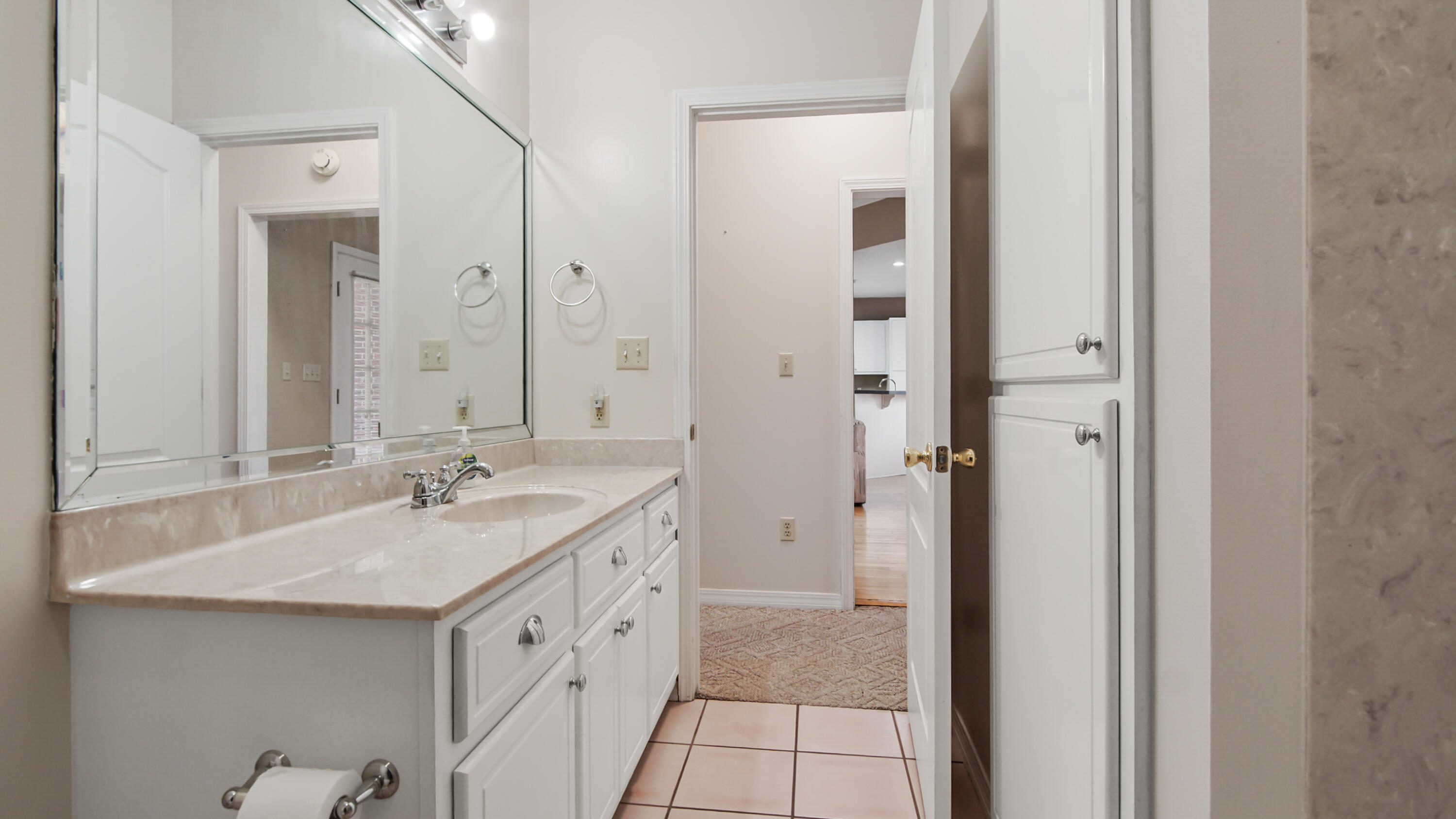 1333 Parrish Road Florala, AL 36442 - Photo 18 of 48 a bathroom with a double vanity sink and mirror
