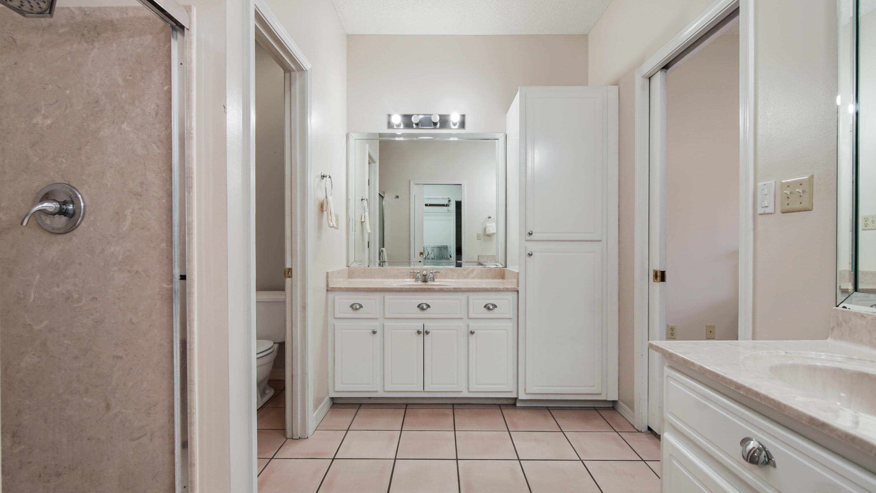 1333 Parrish Road Florala, AL 36442 - Photo 20 of 48 a spacious bathroom with a granite countertop sink mirror and a