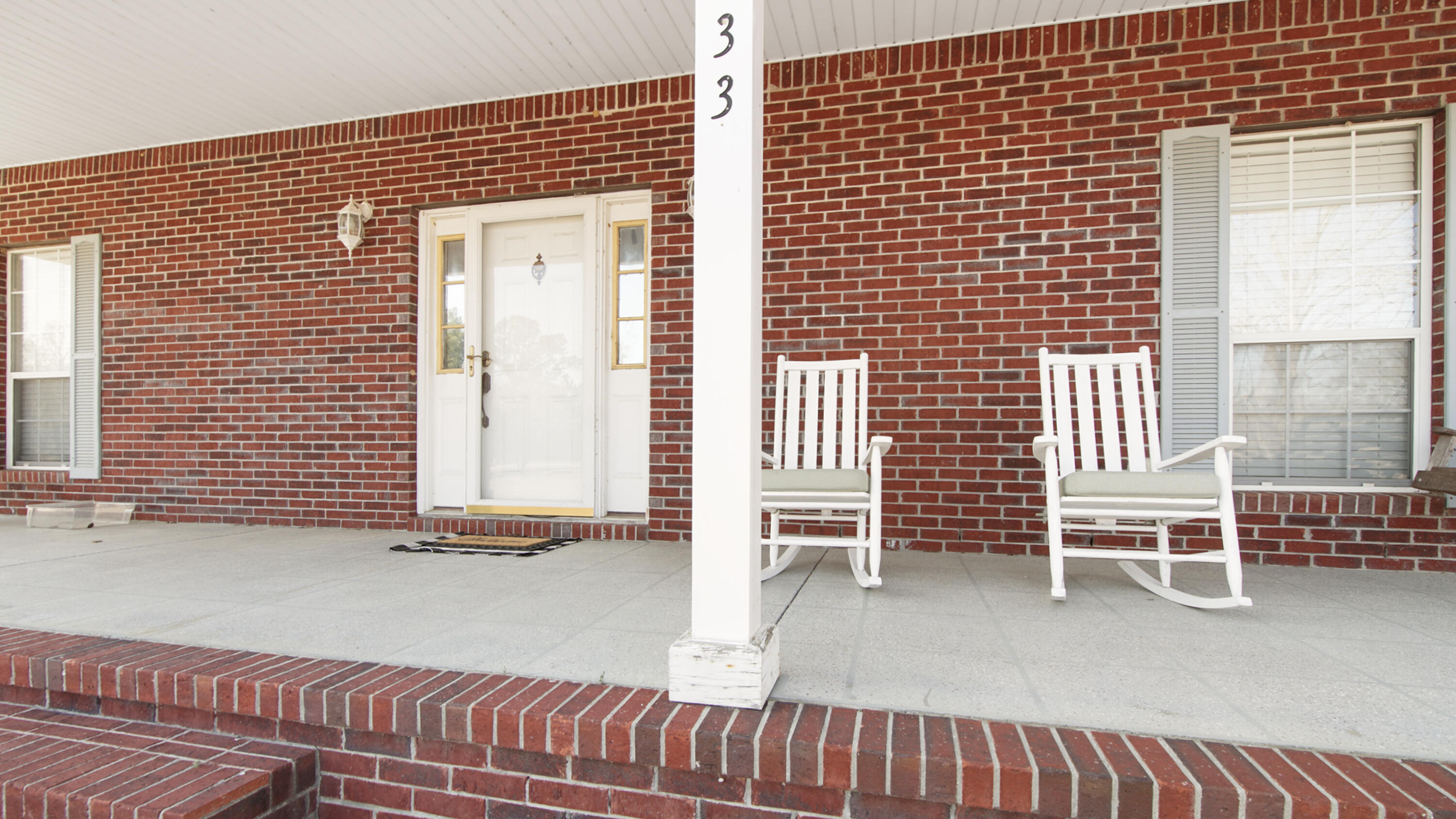 1333 Parrish Road Florala, AL 36442 - Photo 35 of 48 a backyard of a house with barbeque oven table and chairs