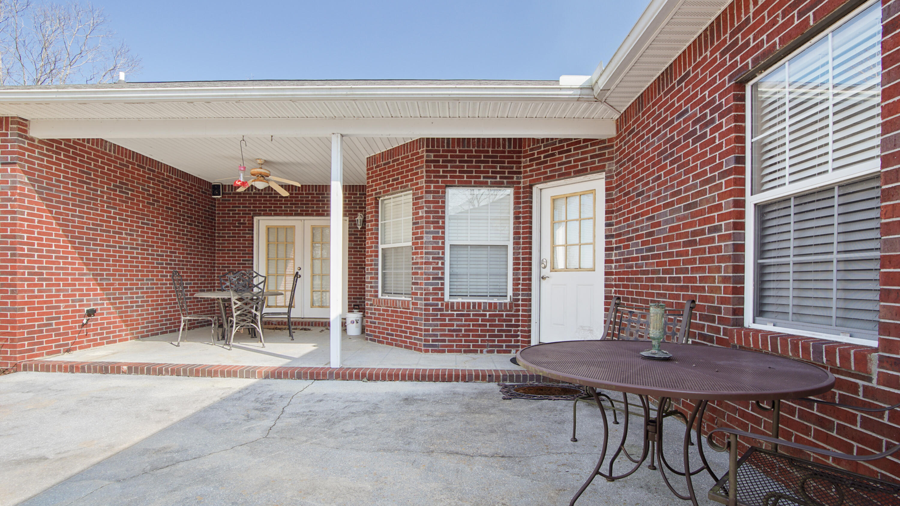 1333 Parrish Road Florala, AL 36442 - Photo 36 of 48 a backyard of a house with table and chairs