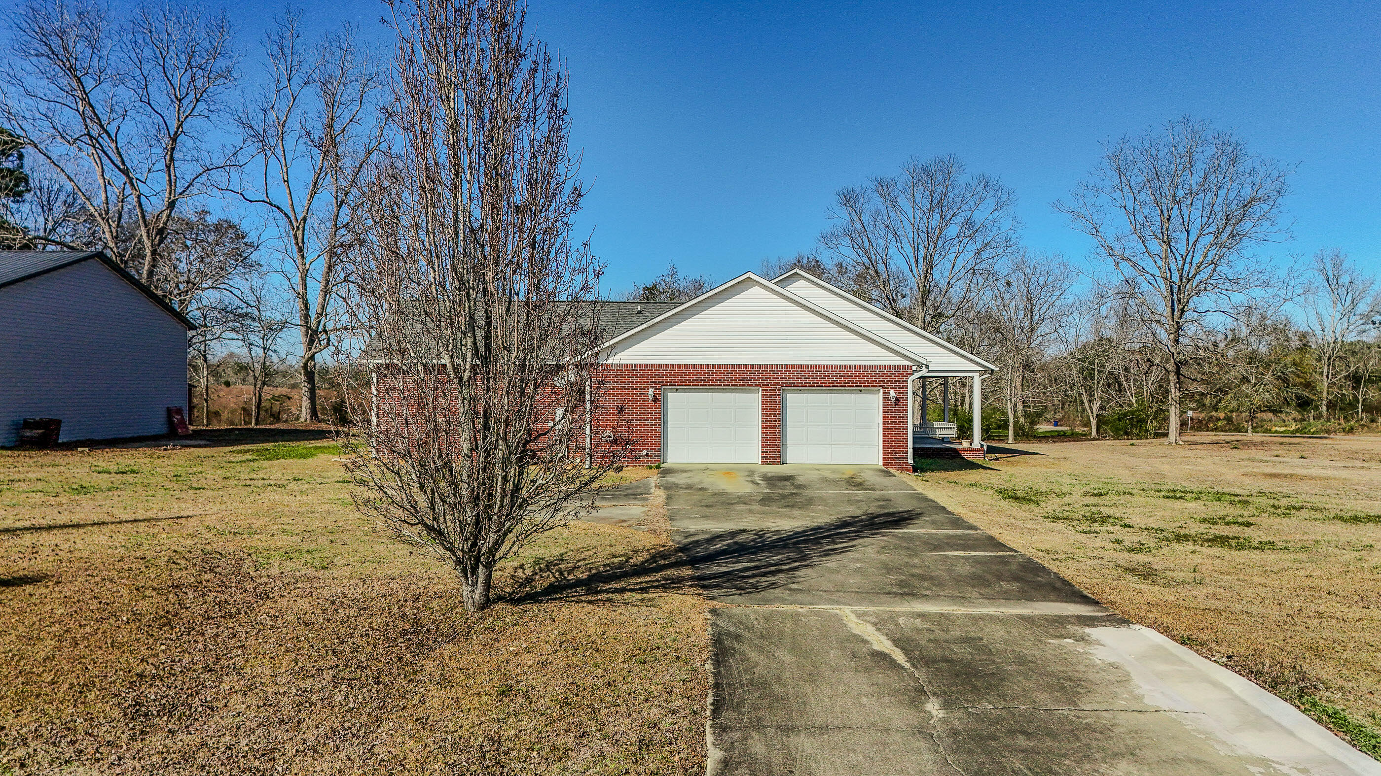 1333 Parrish Road Florala, AL 36442 - Photo 38 of 48 a front view of a house with a yard covered with snow