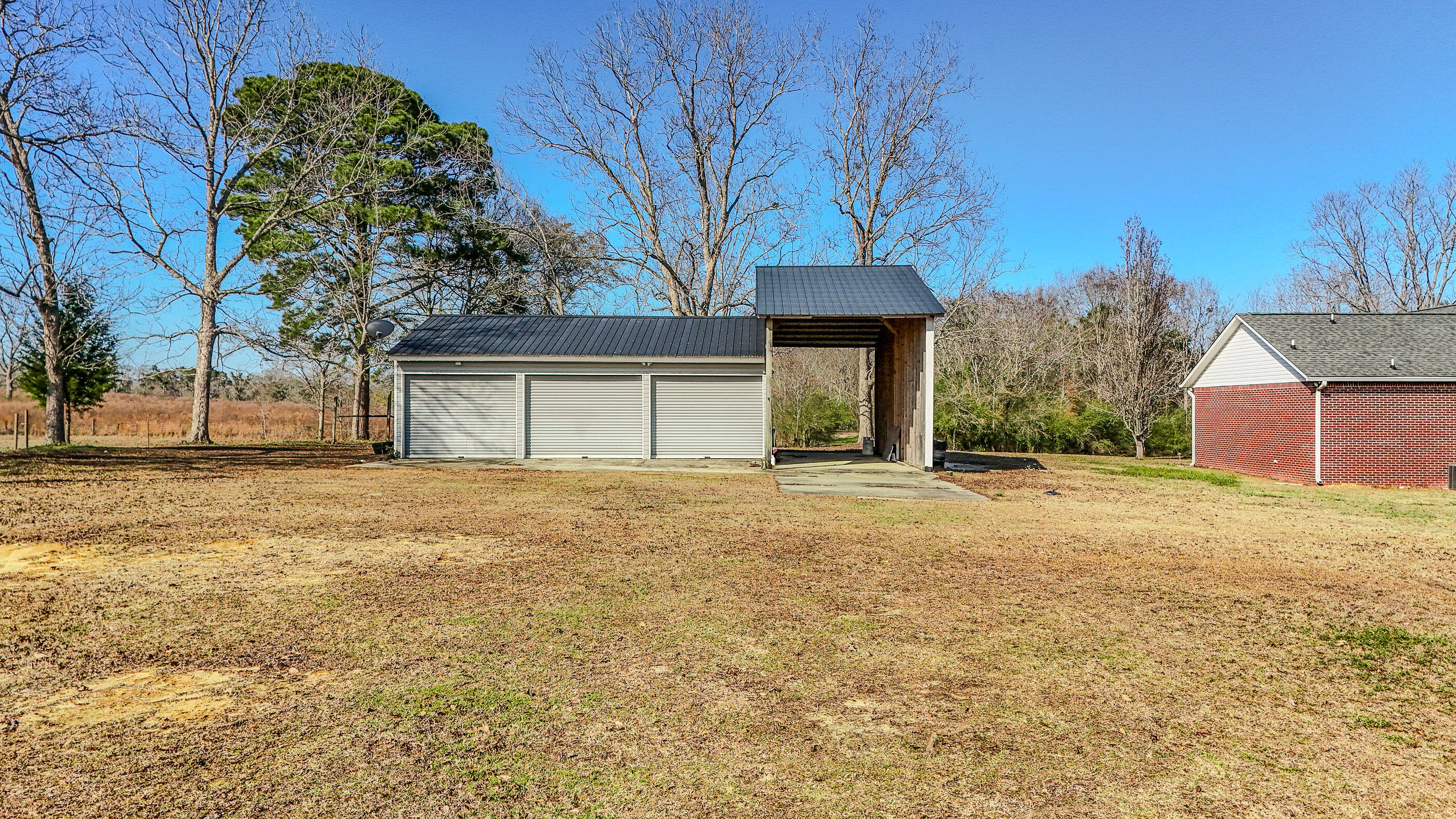 1333 Parrish Road Florala, AL 36442 - Photo 40 of 48 a house with trees in front of it