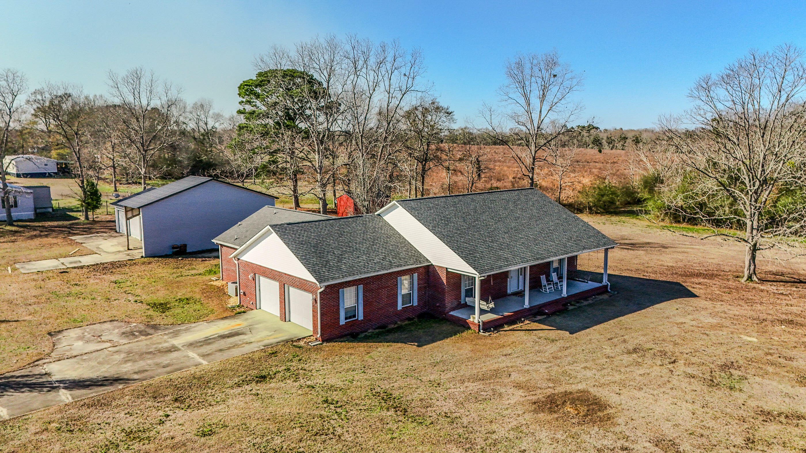 1333 Parrish Road Florala, AL 36442 - Photo 45 of 48 a view of a house with a yard covered with snow in the background